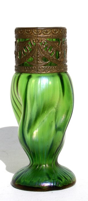 An Art Nouveau Loetz style green iridescent glass vase with pierced metal mount, 15cms (6ins) high.