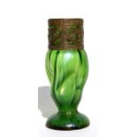 An Art Nouveau Loetz style green iridescent glass vase with pierced metal mount, 15cms (6ins) high.