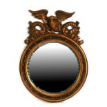 A modern Regency style gilt framed circular wall mirror, 73cms (28.75ins) wide.