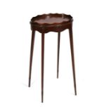 An oval mahogany candle stand with galleried top, on square tapering legs, 36cms (14.25ins) wide.