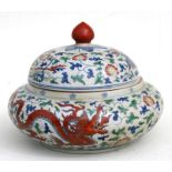 A Chinese doucai bowl & cover decorated with dragons and phoenix amongst foliate scrolls, six