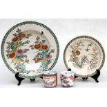 A pair of Japanese yunomi tea cups decorated with flowers; together with a Japanese Satsuma dish and