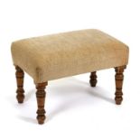 An Edwardian rectangular stool on turned legs.
