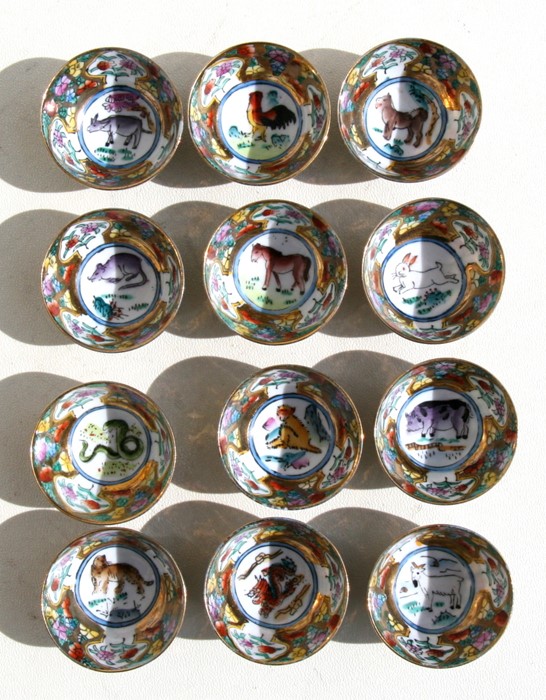 A set of twelve Chinese millefiori wine cups each depicting signs of the Chinese zodiac, 5cms (2ins) - Image 2 of 2