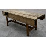 A large pine carpenter's workbench with Record No. 52 wood vice attached, 229cms (90ins) long.