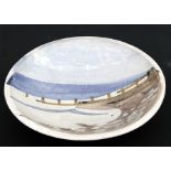 A Michael Woods Studio Pottery shallow bowl decorated with a beach scene, 41cms (16cms) (a/f).