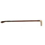 An Edwardian antler handled riding crop with gilt metal collar.