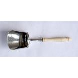 A George IV silver & ivory handled caddy spoon, 9cms (3.5ins) long.