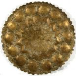 A large Persian gilded brass tray, 49cms (19.25ins) diameter.