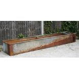 A large galvanised water trough or planter, 244cms (96ins) long.