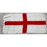 An early 20th century St George Cross cotton flag. 86 by 182cms (33.8 by 71.75ins)Condition