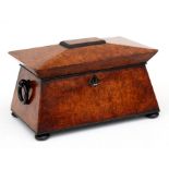 A Regency burr walnut two-division tea caddy of sarcophagus form.