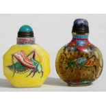 Two Chinese overpainted glass snuff bottles, each decorated with crickets, 6cms (2.25ins) high.