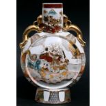 A Japanese porcelain moon flask decorated with figures, with dragon handles, 36cms (14ins) high.