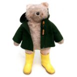 A Gabriel Designs Paddington Bear with green coat and yellow wellington boots, 53cms (21ins) high.