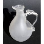 A Victorian frosted glass ice water jug with reservoir to hold crushed ice.