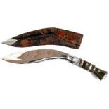 A horn handled kukri in leather scabbard, 44cms (17.25ins) long.