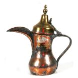A tinned copper & brass Turkish / Islamic dallah coffee pot, 29cms (11.5ins) high.