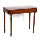 A Regency figured mahogany card table with rosewood crossbanded top, on turned tapering legs,