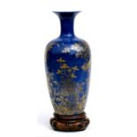 A Chinese powder blue vase with gilded decoration depicting a golden pheasant amongst foliage, on