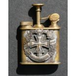 A brass WWII trench art oil atomiser with applied '1935-45 Wehrmacht' badge, 6cms (2.25ins) high.