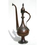 An Eastern / Islamic copper coffee pot, 45cms (17.5ins) high.