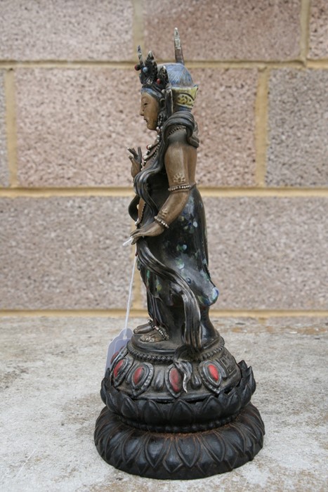 A Chinese glazed and gilded Buddhist deity figure on a hardwood lotus stand, 28cms (11ins) high. - Image 4 of 10