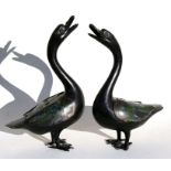 A pair of Chinese bronze & enamel censers in the form of geese, 39cms (15.25ins) high (2).