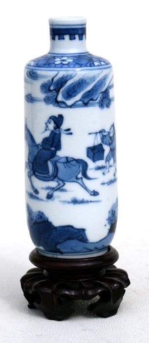 A Chinese blue & white snuff bottle decorated with a robed figure on horseback with a servant