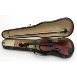 A two piece back violin & bow, cased.