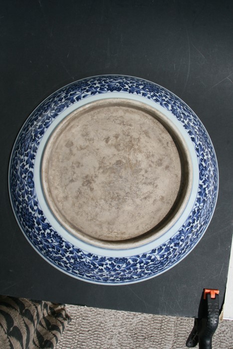 A large Chinese blue & white charger with central lotus flowers within a foliate border, 42cms (16. - Image 12 of 12