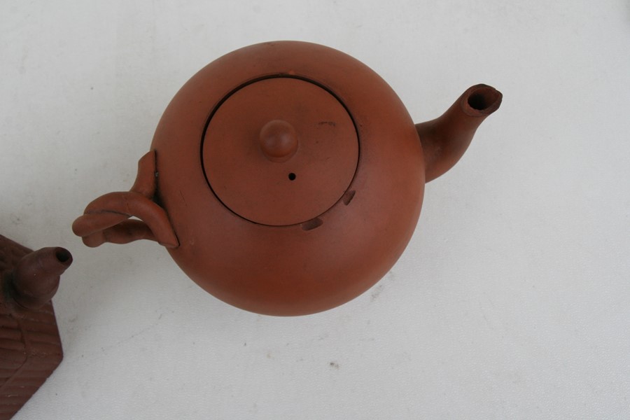 A group of three Chinese Yixing pottery teapots, the largest 18cms (7.2ins) wide.Condition Report - Image 9 of 11