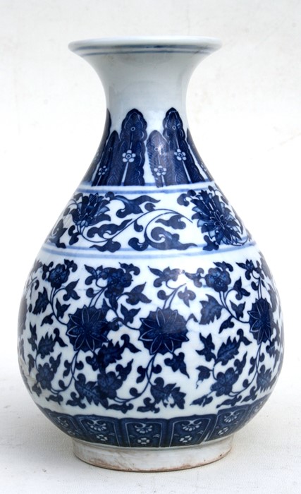 A Chinese blue & white vase decorated with foliate scrolls, six character seal mark to underside,