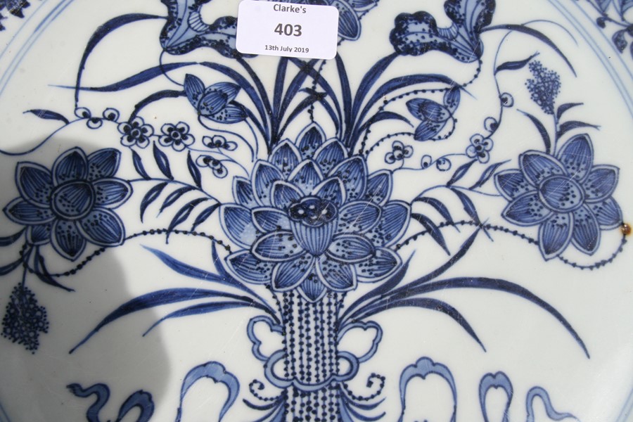 A large Chinese blue & white charger with central lotus flowers within a foliate border, 42cms (16. - Image 7 of 12