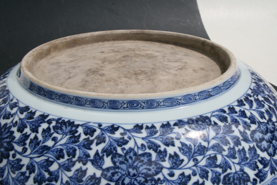 A large Chinese blue & white charger with central lotus flowers within a foliate border, 42cms (16. - Image 9 of 12
