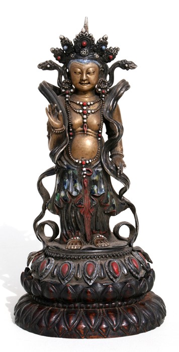 A Chinese glazed and gilded Buddhist deity figure on a hardwood lotus stand, 28cms (11ins) high.