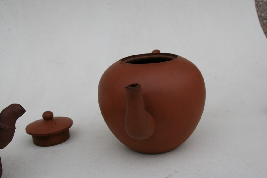 A group of three Chinese Yixing pottery teapots, the largest 18cms (7.2ins) wide.Condition Report - Image 10 of 11