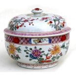 A Chinese famille rose bowl & cover decorated with flowers, six character red mark to underside,
