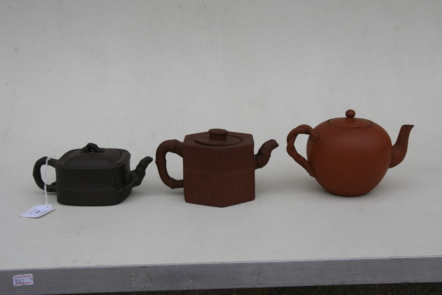 A group of three Chinese Yixing pottery teapots, the largest 18cms (7.2ins) wide.Condition Report - Image 6 of 11