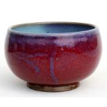 A Chinese Jun ware bowl with mottled red and blue glaze, 14cms (5.5ins) diameter.