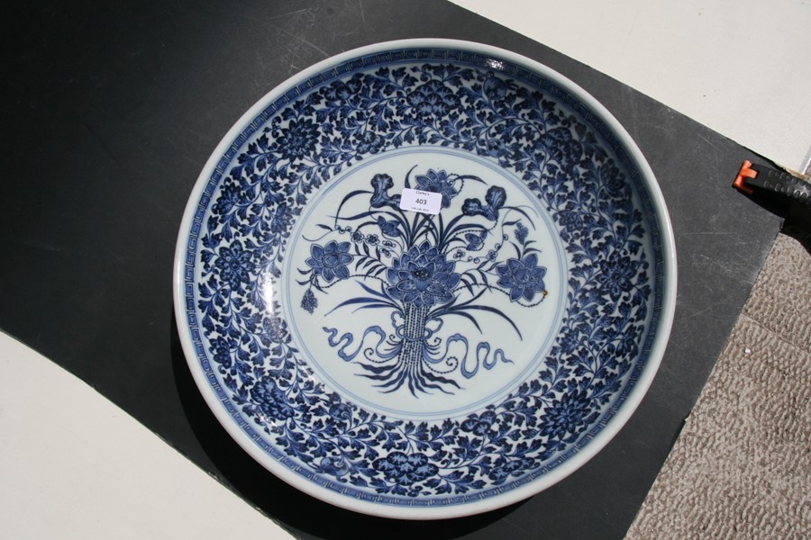 A large Chinese blue & white charger with central lotus flowers within a foliate border, 42cms (16. - Image 3 of 12