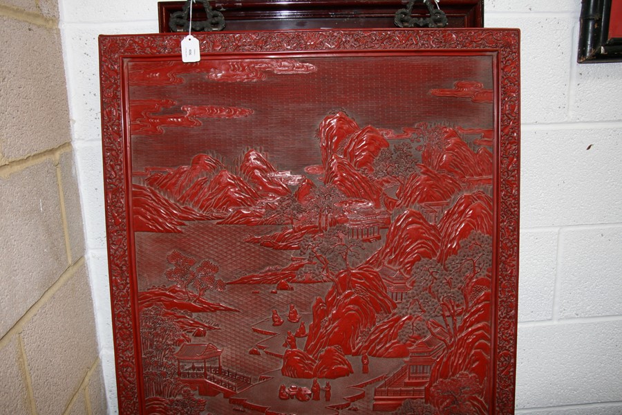 A large Chinese carved red cinnabar panel depicting a mountainous river scene within a foliate - Image 13 of 13