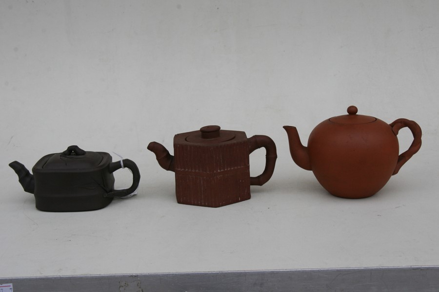 A group of three Chinese Yixing pottery teapots, the largest 18cms (7.2ins) wide.Condition Report - Image 5 of 11