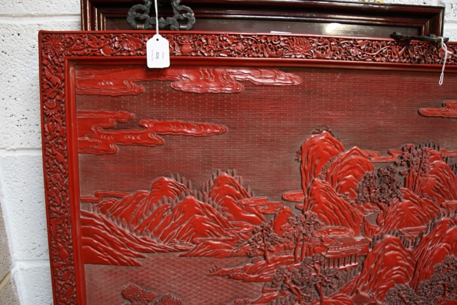A large Chinese carved red cinnabar panel depicting a mountainous river scene within a foliate - Image 3 of 13