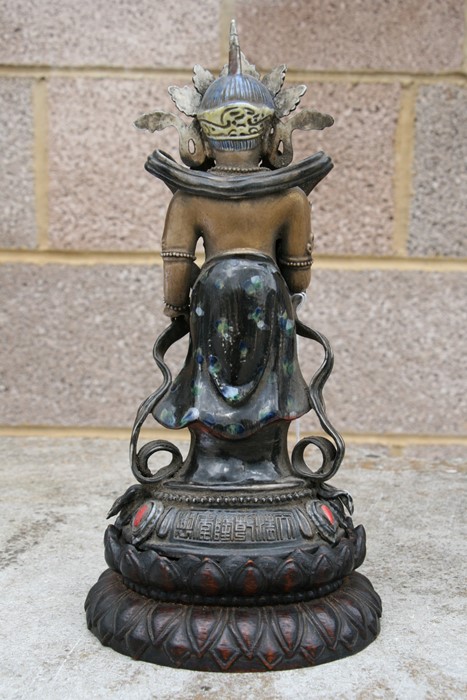 A Chinese glazed and gilded Buddhist deity figure on a hardwood lotus stand, 28cms (11ins) high. - Image 5 of 10