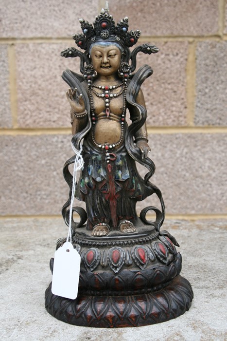 A Chinese glazed and gilded Buddhist deity figure on a hardwood lotus stand, 28cms (11ins) high. - Image 3 of 10