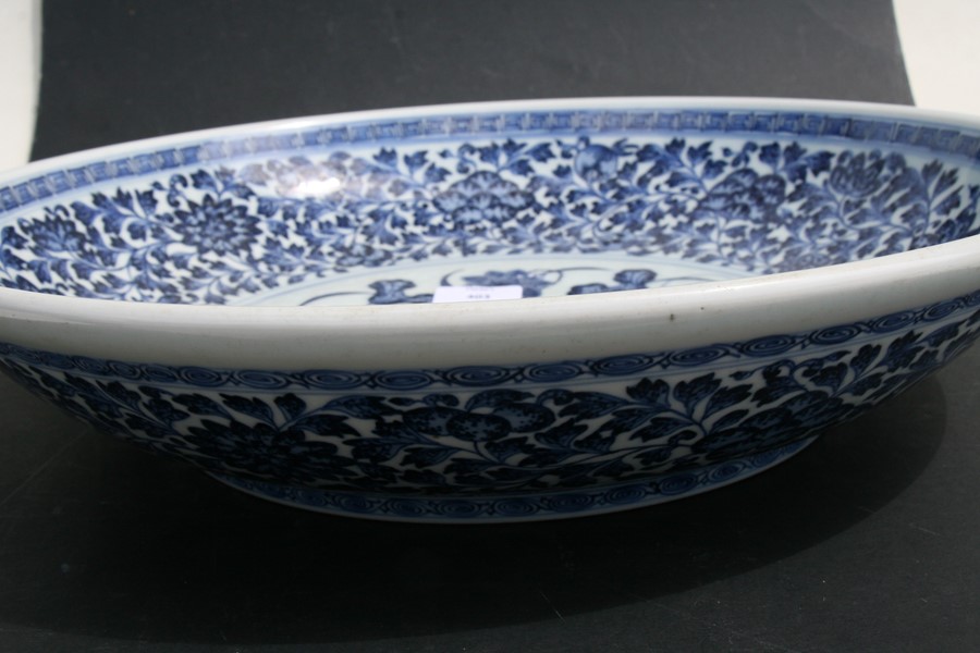 A large Chinese blue & white charger with central lotus flowers within a foliate border, 42cms (16. - Image 5 of 12