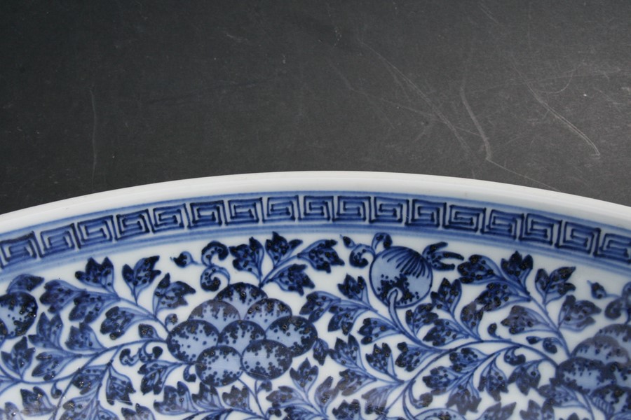 A large Chinese blue & white charger with central lotus flowers within a foliate border, 42cms (16. - Image 6 of 12