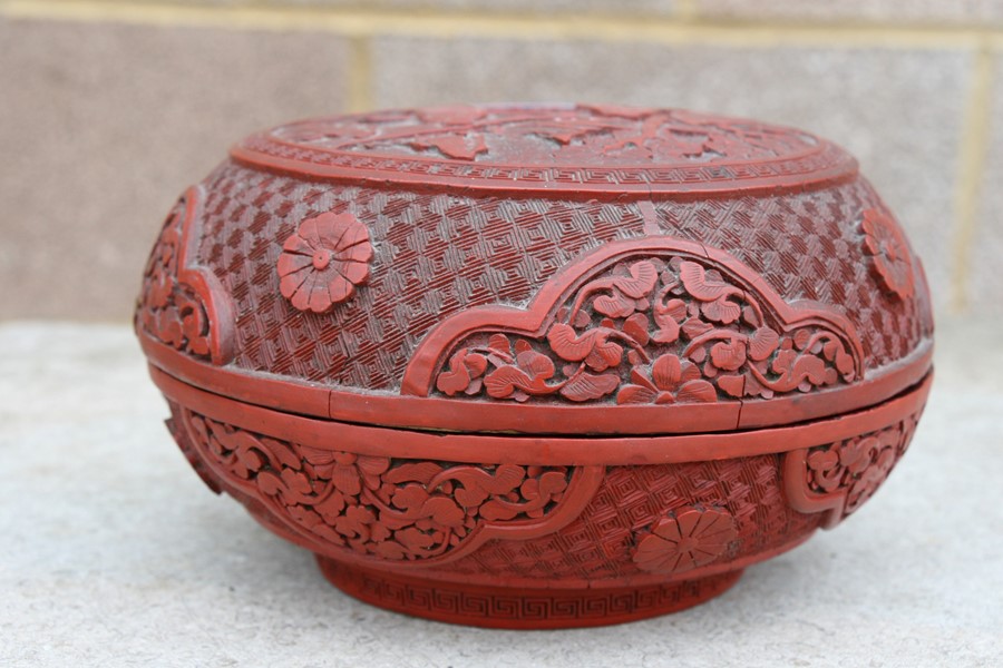 A Chinese cinnabar lacquer box & cover of compressed globular form, decorated with flowers and - Image 20 of 25