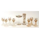 Seven gilded wine glasses decorated with insects, 16cms (6.25ins) high; together with a matching